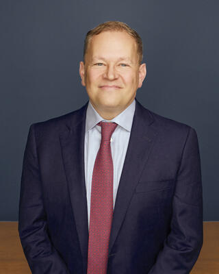 B. Christopher DiSantis, Partner and Head of Resources Group at American Securities